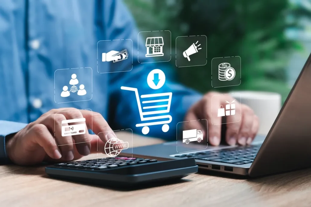 A person on their laptop with e-commerce graphics above