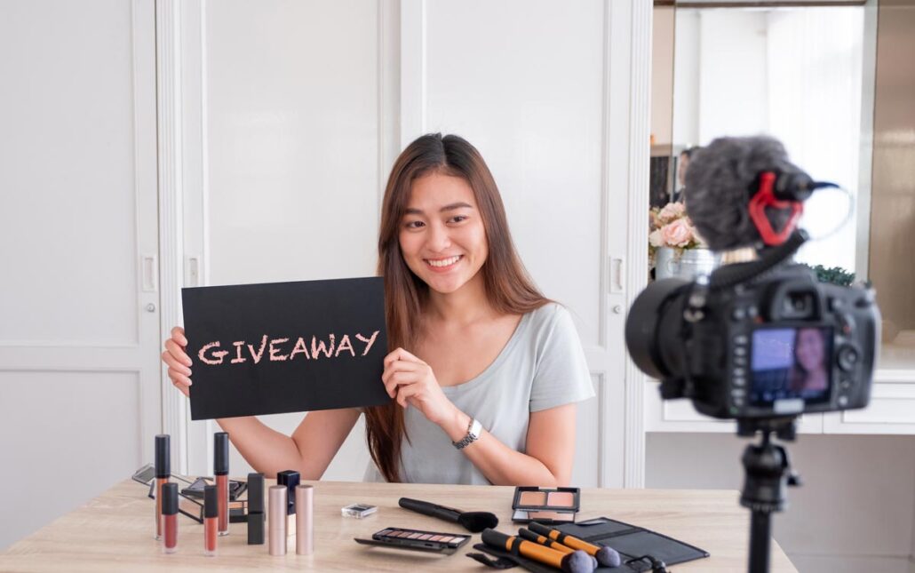 A woman holding a giveaway sign to post on social media