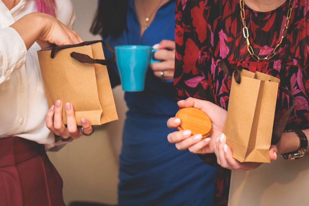 Employees with company swag gifts