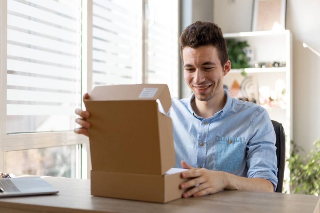 A happy man looking at gift