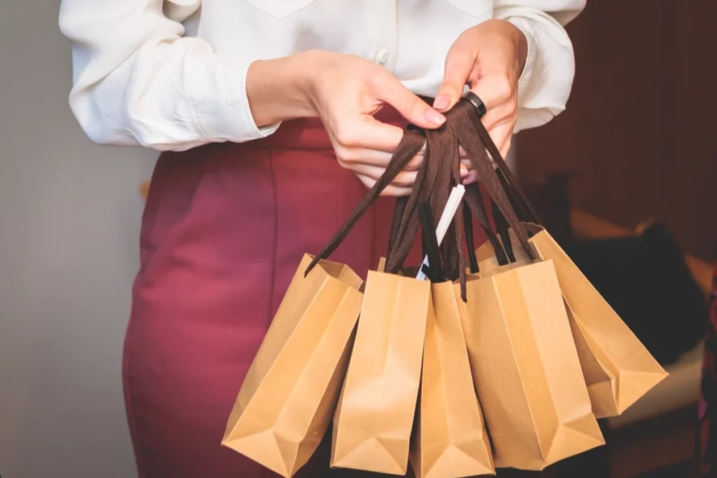 A person handing out company gifts