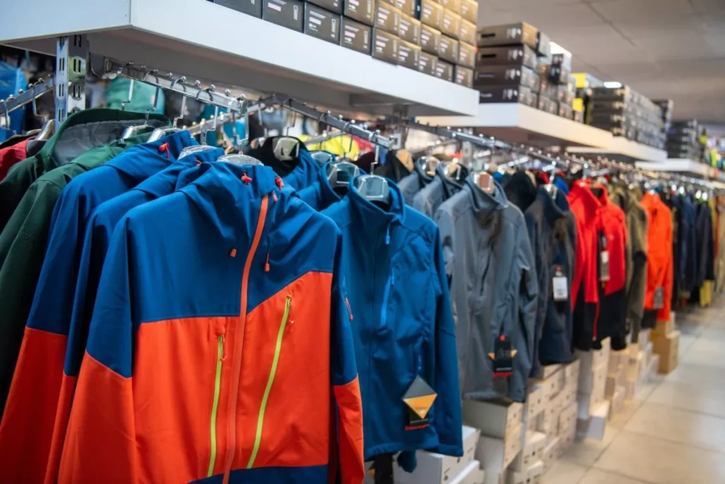 A row of colorful jackets in a company store.