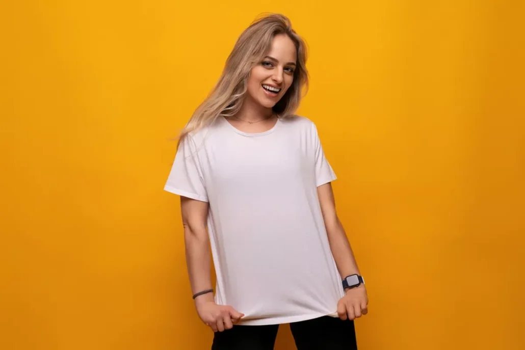 A happy woman in a plain white t shirt.